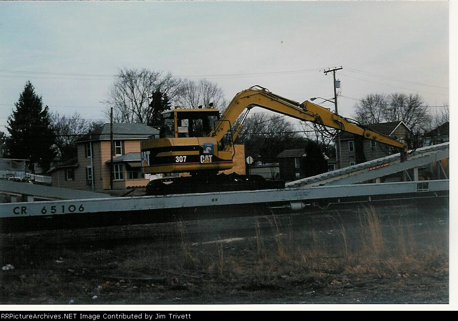 Cat 307 excavator on excavator ramp car
